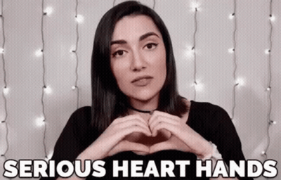 Woman Making Heart Shape Saying Serious Heart Hands GIF