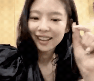 Woman Making Heart Shape With Fingers GIF
