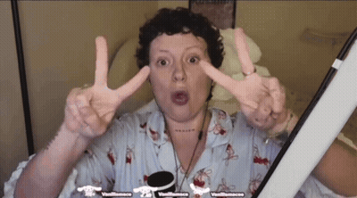 Woman Making Peace Sign In Front Of Vanillasauce Screen GIF