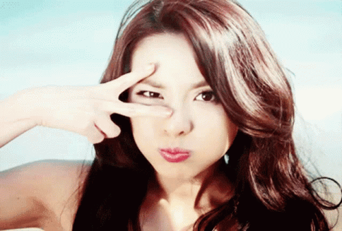 Woman Making Peace Sign GIF
