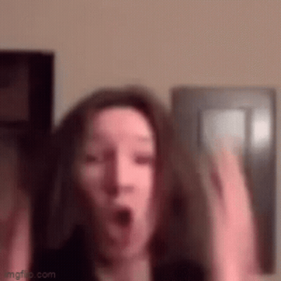 Woman Making Surprised Face With Hands Up GIF