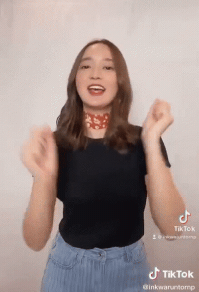 Woman Making TikTok Black Shirt Blue Jeans GIF