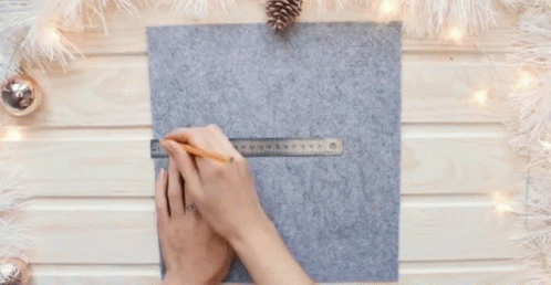 Woman Measuring Felt With Ruler And Pencil GIF