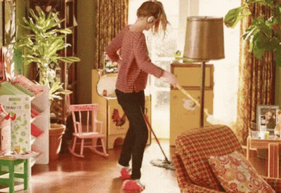 Woman Mopping Living Room Floor Listening To Music GIF