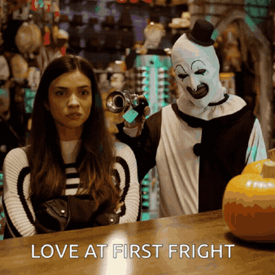 Woman Next To Clown Holding Camera Love At First Fright GIF