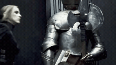 Woman Next To Man In Armor GIF