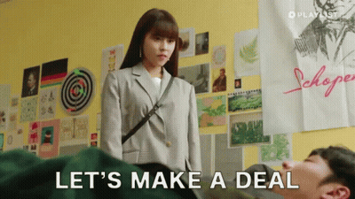 Woman Next To Man Saying Let's Make A Deal GIF