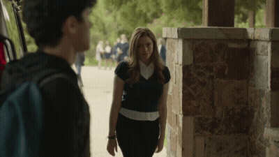 Woman Next To Man With Backpack GIF
