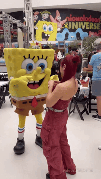 Woman Next To Spongebob Mascot Nickelodeon Universe Sign GIF