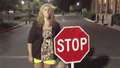 Woman Next To Stop Sign GIF