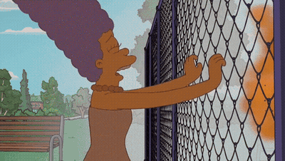Woman Next To TNT Chain Link Fence GIF