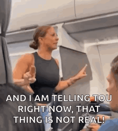 Woman On Airplane Giving Middle Finger Saying And I Am Telling You Right Now That Thing Is Not Real GIF