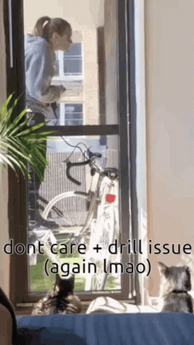 Woman On Balcony Talking On Cell Phone With Bicycle GIF