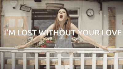 Woman On Balcony With I'm Lost Without Your Love GIF