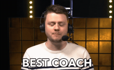 Woman On Balcony With Sign Coach Mek Wishes You Strength And Joy In The New Year GIF