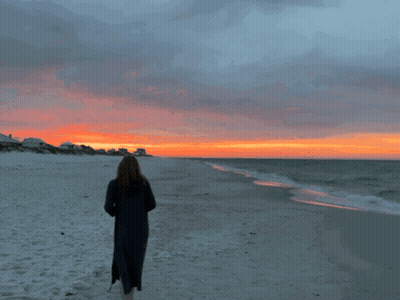 Woman On Beach Watching Sunset GIF