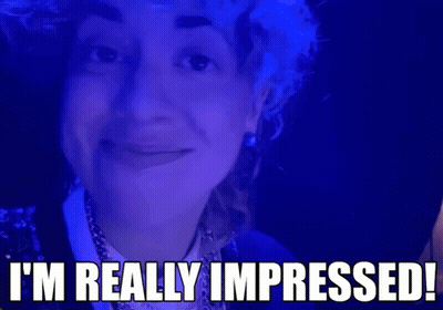 Woman On Blue Background Saying I'm Really Impressed GIF