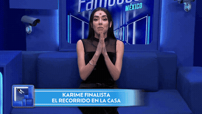 Woman On Blue Couch With Sign Karime Finalista GIF