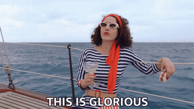 Woman On Boat Holding Wine Saying This Is Glorious GIF