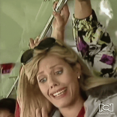 Woman On Bus With Nuestra Tele Logo GIF