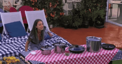 Woman On Chair At Table With Pots And Pans GIF