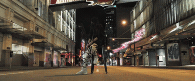 Woman On City Street Under Aesthetic Sign GIF