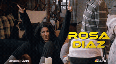 Woman On Couch Arms In Air Rosa Diaz GIF
