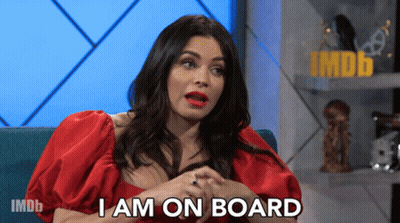 Woman On Couch Saying I Am On Board GIF