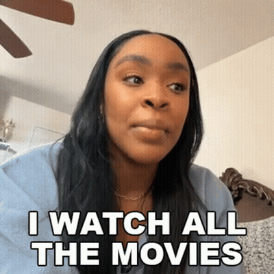 Woman On Couch Saying I Watch All The Movies GIF
