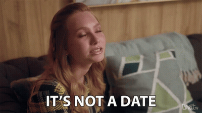 Woman On Couch Saying It's Not A Date GIF