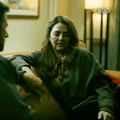 Woman On Couch Talking To Man With HBO GIF