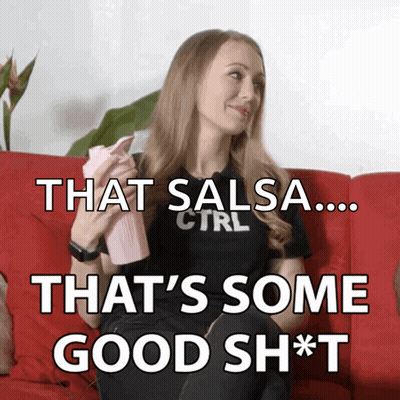 Woman On Couch With Pink Bottle Saying That Salsa That's Some Good Shit GIF