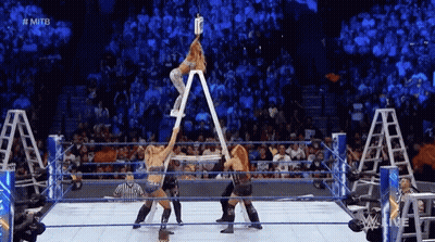 Woman On Ladder In Wrestling Ring Holding Beer GIF
