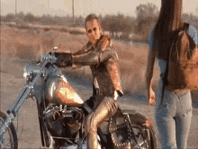Woman On Motorcycle And Woman Standing GIF