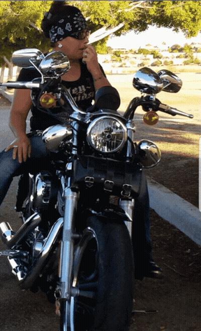 Woman On Motorcycle Wearing Biker Shirt GIF