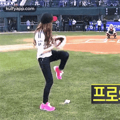 Woman On One Leg With Baseball Glove On Field GIF