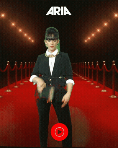 Woman On Red Carpet In Front Of YouTube Music Sign GIF