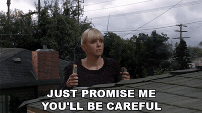 Woman On Roof With Bottle Saying Just Promise Me You'll Be Careful GIF