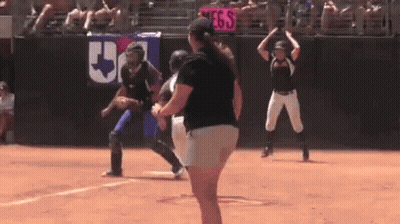 Woman On Softball Field With Catcher And Umpire GIF