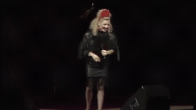 Woman On Stage With Guitar And Stool GIF