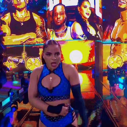 Woman On Stage With Jaida Parkes On Screen GIF