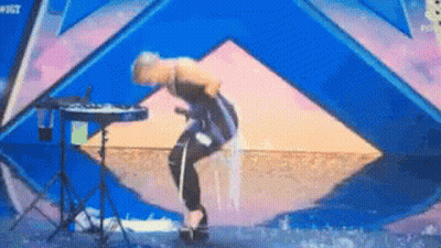 Woman On Stage With Keyboard And Number 8 GIF