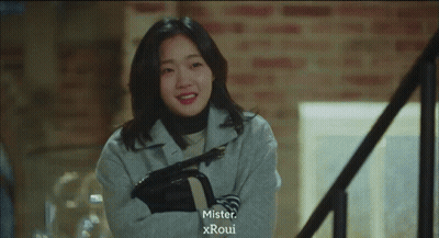 Woman On Stairs With Mister Xroui Above GIF