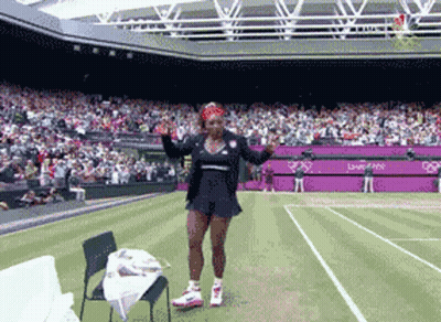 Woman On Tennis Court In Front Of London 2012 Stadium GIF