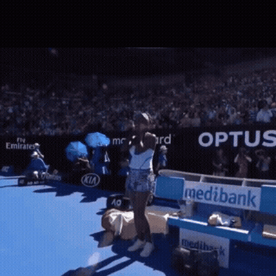 Woman On Tennis Court In Front Of Optus Sign GIF