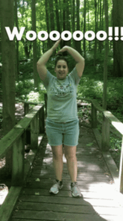Woman On Wooden Bridge Arms Up Wooooo GIF