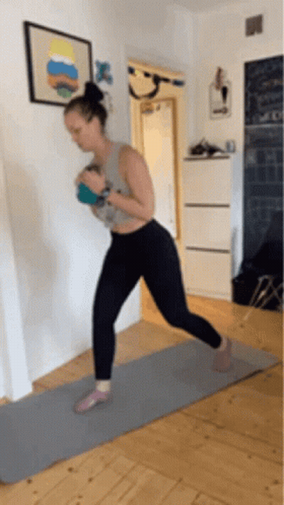 Woman On Yoga Mat Holding Ball GIF