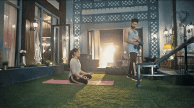 Woman On Yoga Mat Man With Dumbbells GIF