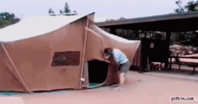 Woman Opening Tent With Hose Attached GIF