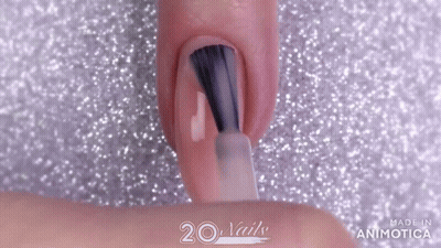 Woman Painting Nails With Brush On Glittery Surface GIF